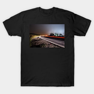 Foggy night on Ilkley Moor light trails on the road T-Shirt